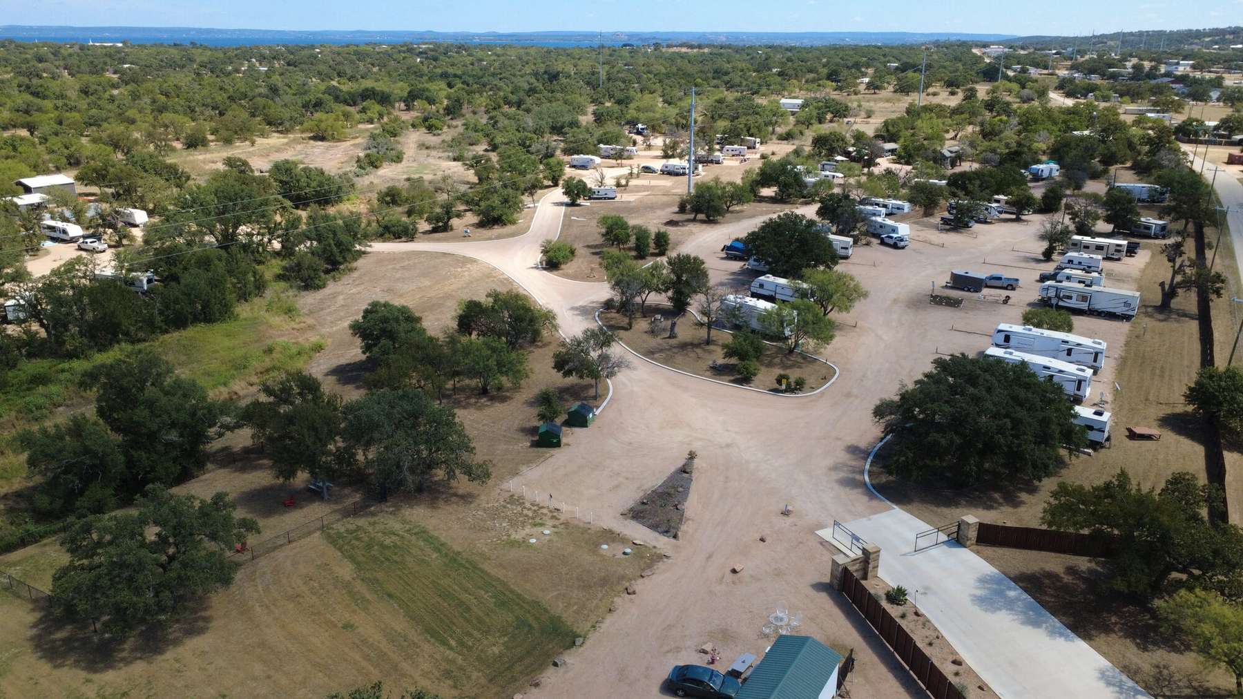Aerial view of Seven Lakes RV Resort with Lake Buchanan on the horizon